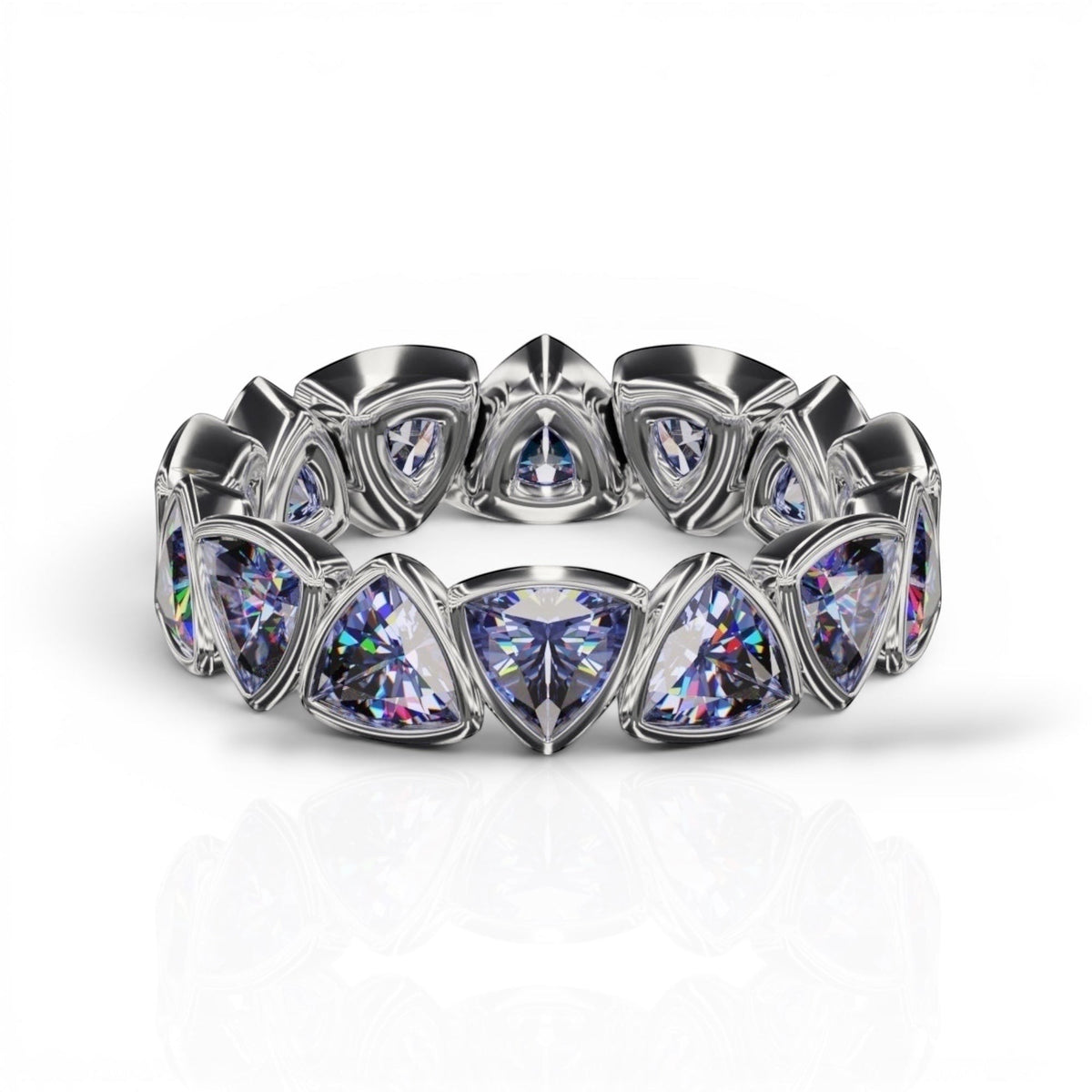 YFS Designs 4mm trillion faceted tanzanite eternity band set in a polished silver bezel setting.
