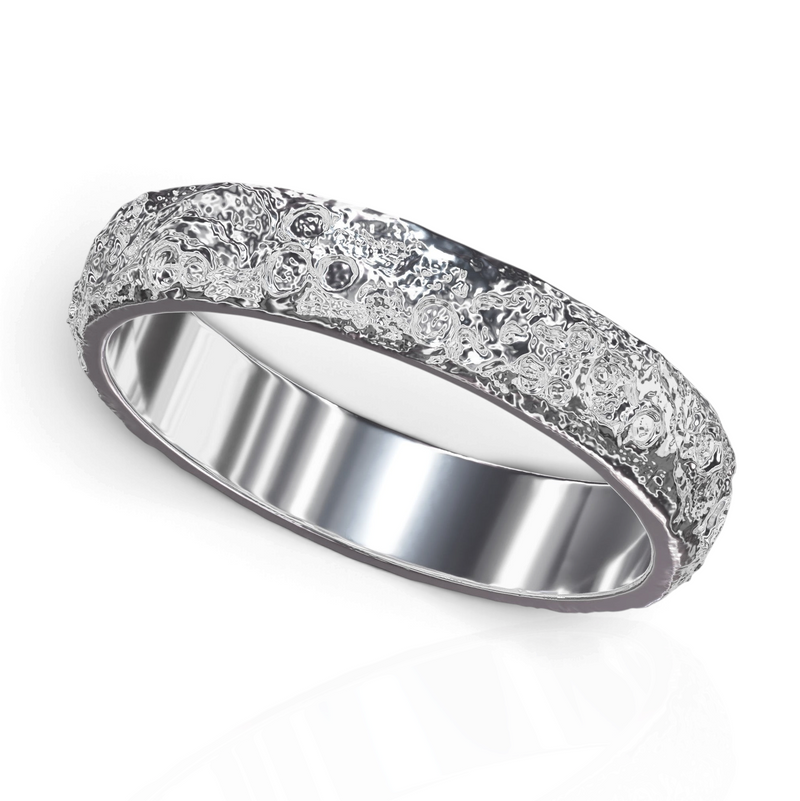 YFS Designs Luna Piena silver ring with a textured moon-inspired crater surface and a smooth polished interior band.