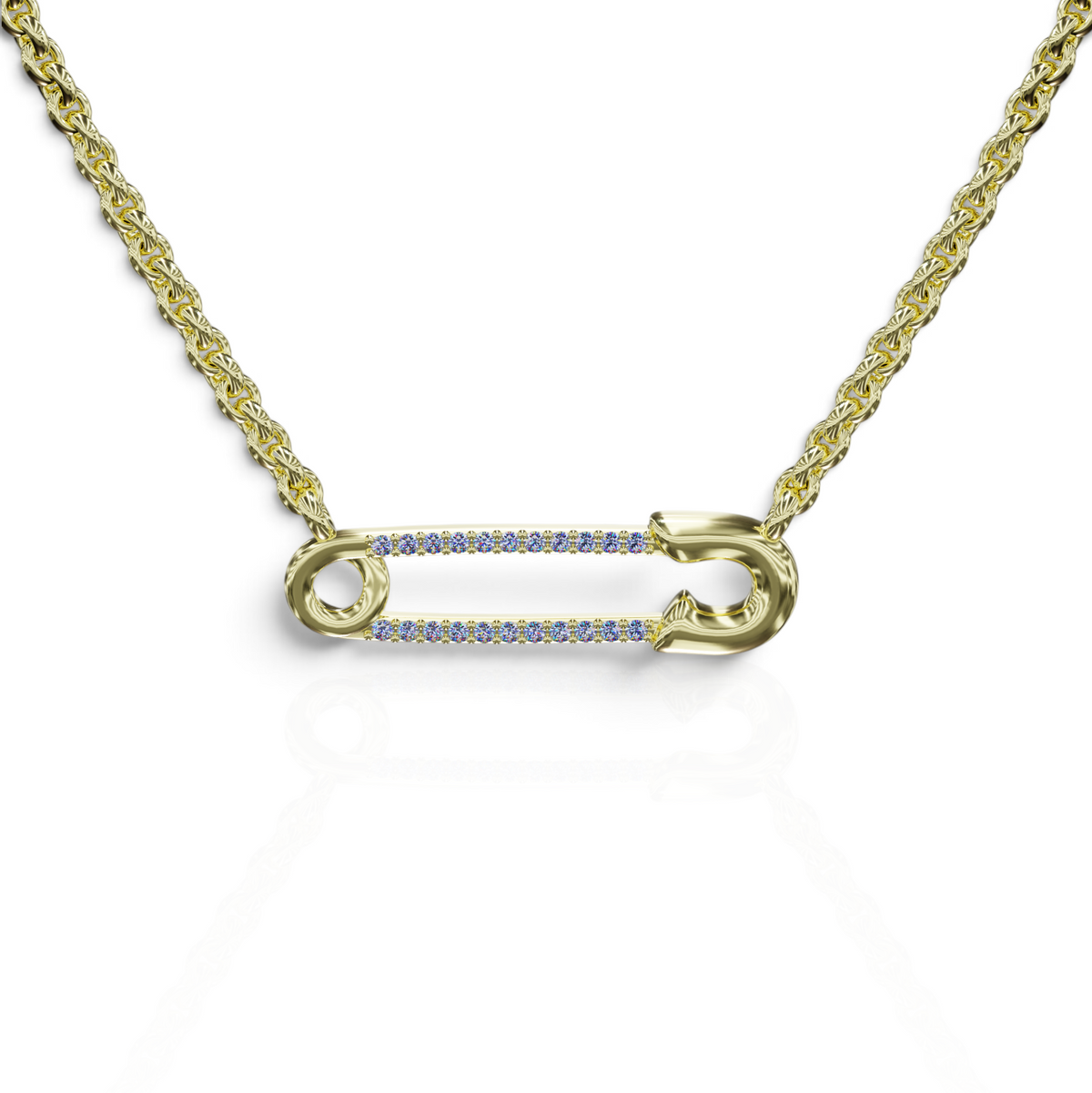 YFS Designs safety pin pendant necklace featuring natural 1mm tanzanite gemstones on a gold cable chain.