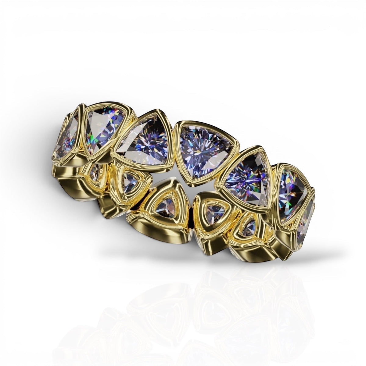 YFS Designs 4mm trillion faceted tanzanite bezel band in yellow gold with a repeating geometric gemstone pattern