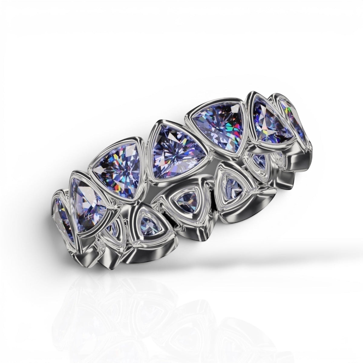 YFS Designs 4mm trillion faceted tanzanite bezel band in polished silver, featuring multiple triangular gemstones.